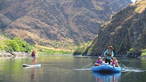 a hells canton rafting trip goes down the snake river with 1 raft and a paddleboard