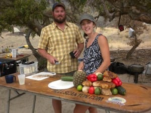 2 guides prepare a delicious dinner feast or a salmon river rafting trip
