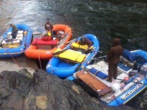 4 rafts are being packed and rigged at the Hells Canyon Dam, the starting place of all Hells Canyon Whitewater Rafting Trips