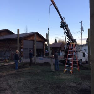 a crane starts the construction of a new river shop