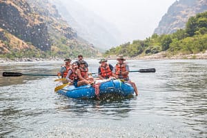 A raft on calm water on the Snake River during a Hells Canyon Rafting Trip