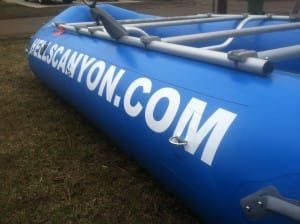 new blue raft and frame with hells canyon painted on the side