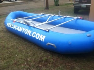 blue raft with brand new frame and hells canyon painted down the side