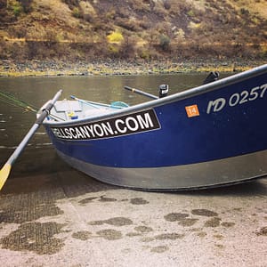 a drift boat waits to be boarded for a fishing trip on the cement ramp of the salmon river